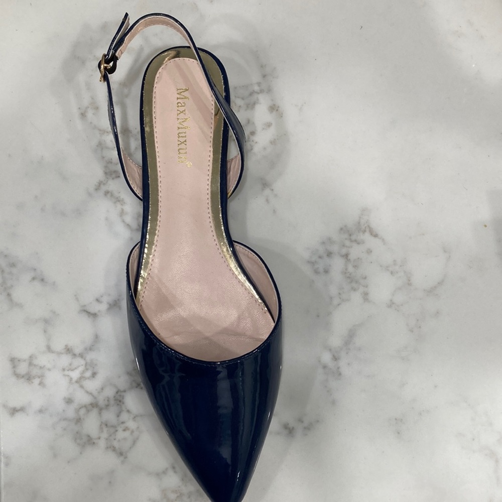 Navy patent slingback shoes.